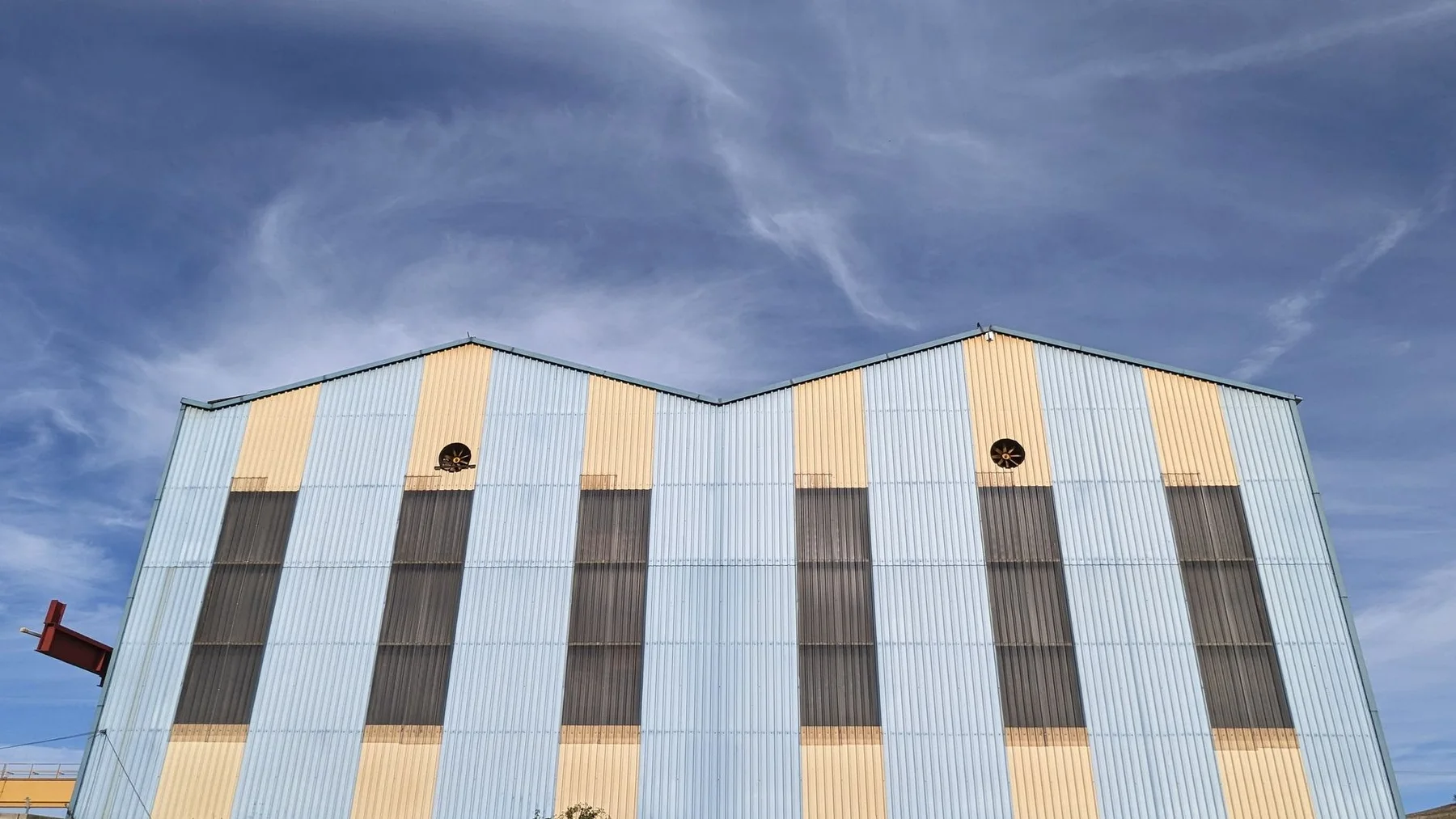 Industrial commercial building with vertical facade panels